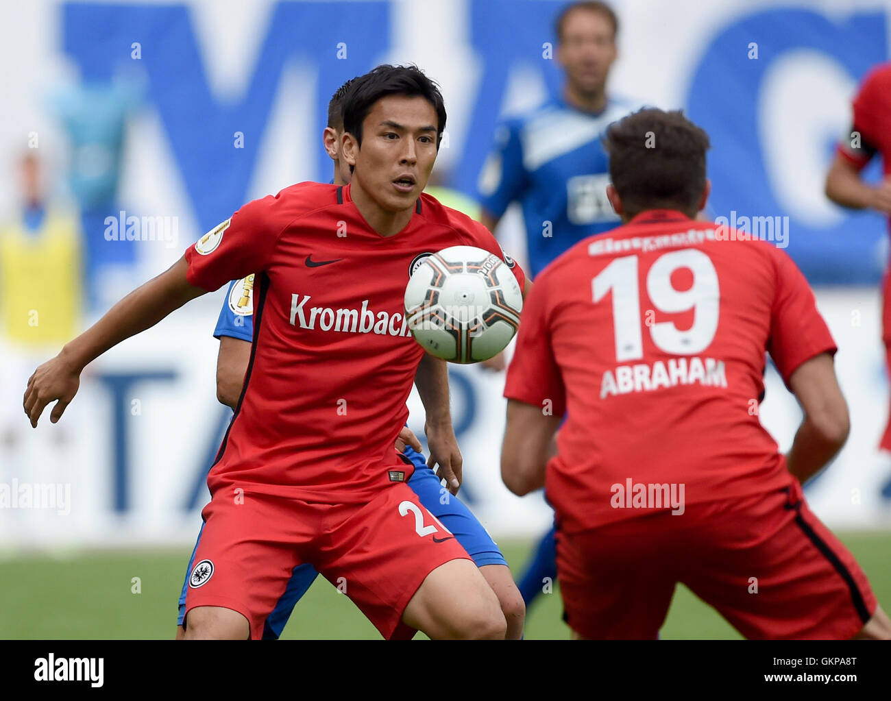 Magdeburg, Germany. 21st Aug, 2016. Frankfurt's Makoto Hasebe (l) and David Abraham with the ball in the match of 1. FC Magdeburg against Eintracht Frankfurt in the first round of the DFB Cup at the MDCC-Arena in Magdeburg, Germany, 21 August 2016. Eintracht Frankfurt won the match on penalties. Photo: Britta Pedersen/dpa/Alamy Live News Stock Photo