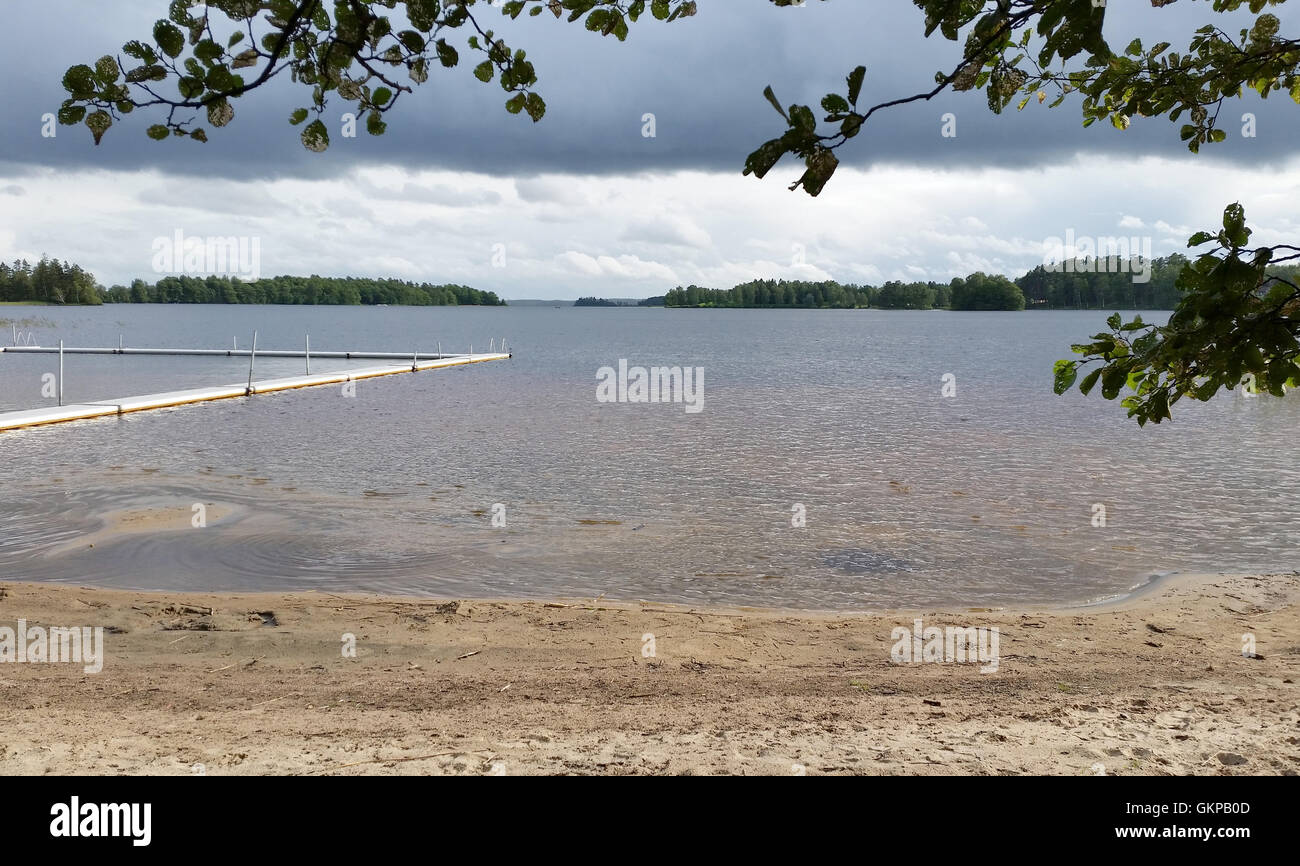 Unnaryd, Sweden. 12th Aug, 2016. View onto lake Unnen with beach in Unnaryd, Sweden, 12 August 2016. Photo: Johannes Hennemuth - NO WIRE SERVICE -/dpa/Alamy Live News Stock Photo