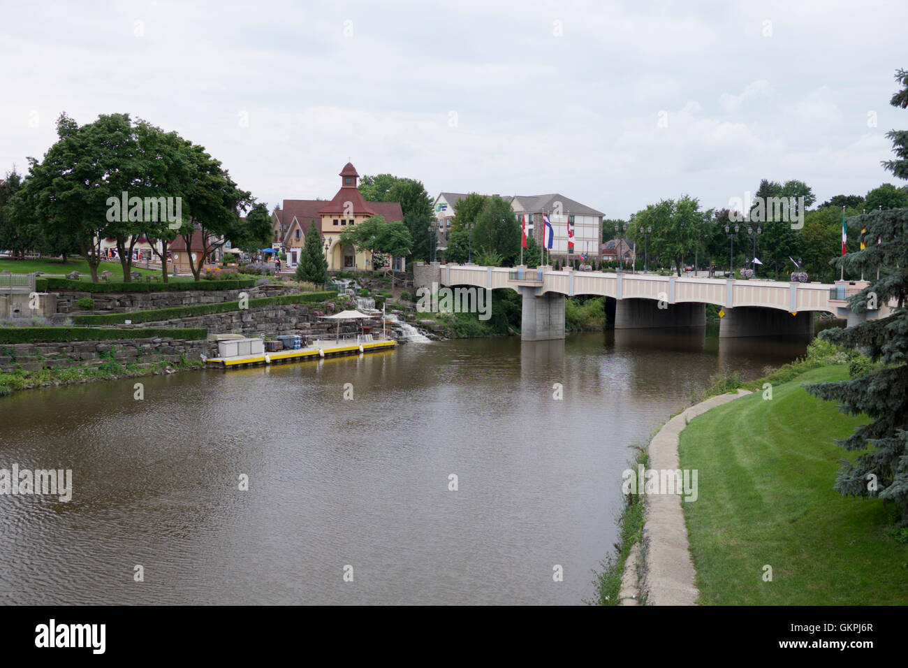 Bridge crossing the Cass River in Frankenmuth, Michigan. Shops across