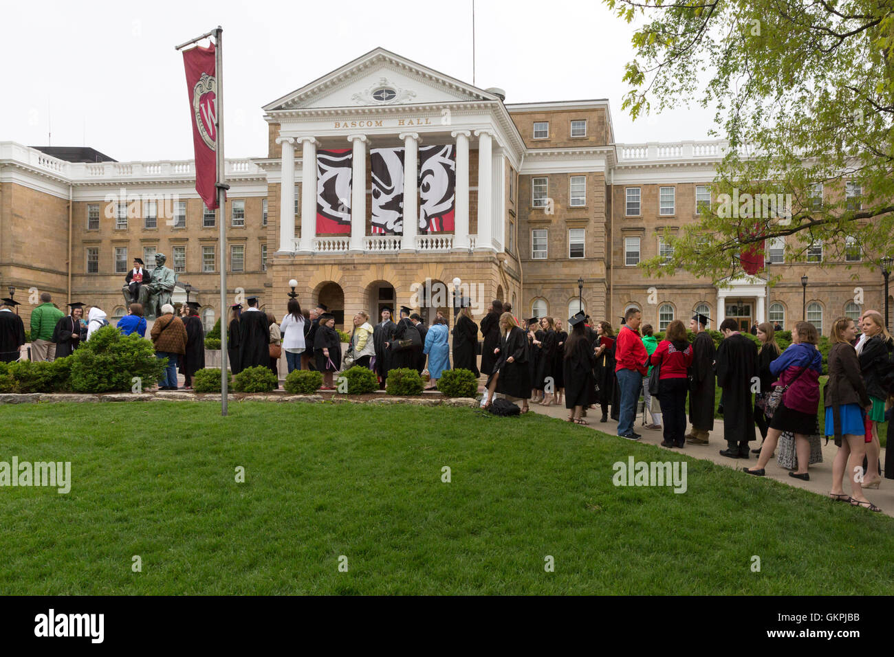 Graduates lined up to have their photo taken sitting on the Abraham