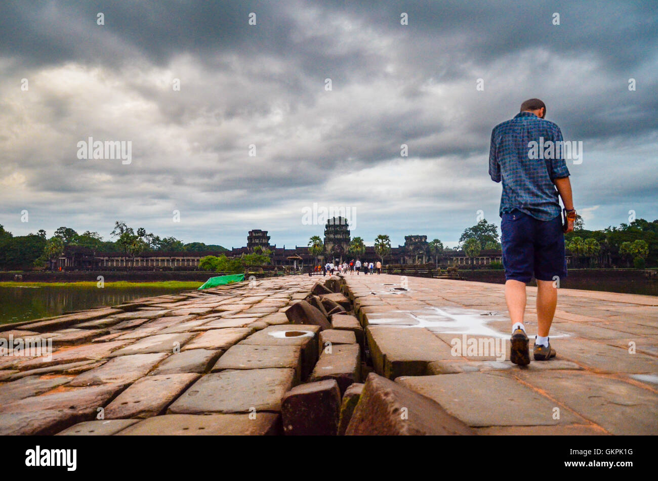 Young man visiting Angkor Wat Temple, UNESCO World Heritage, Siem Reap Province, Cambodia Stock Photo