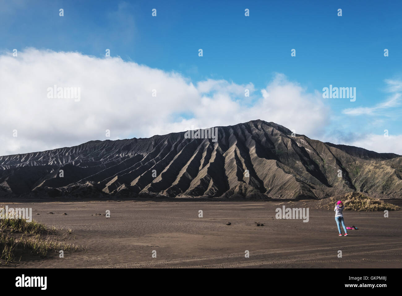 Landscape of Mount Bromo, Indonesia with tourist woman Stock Photo