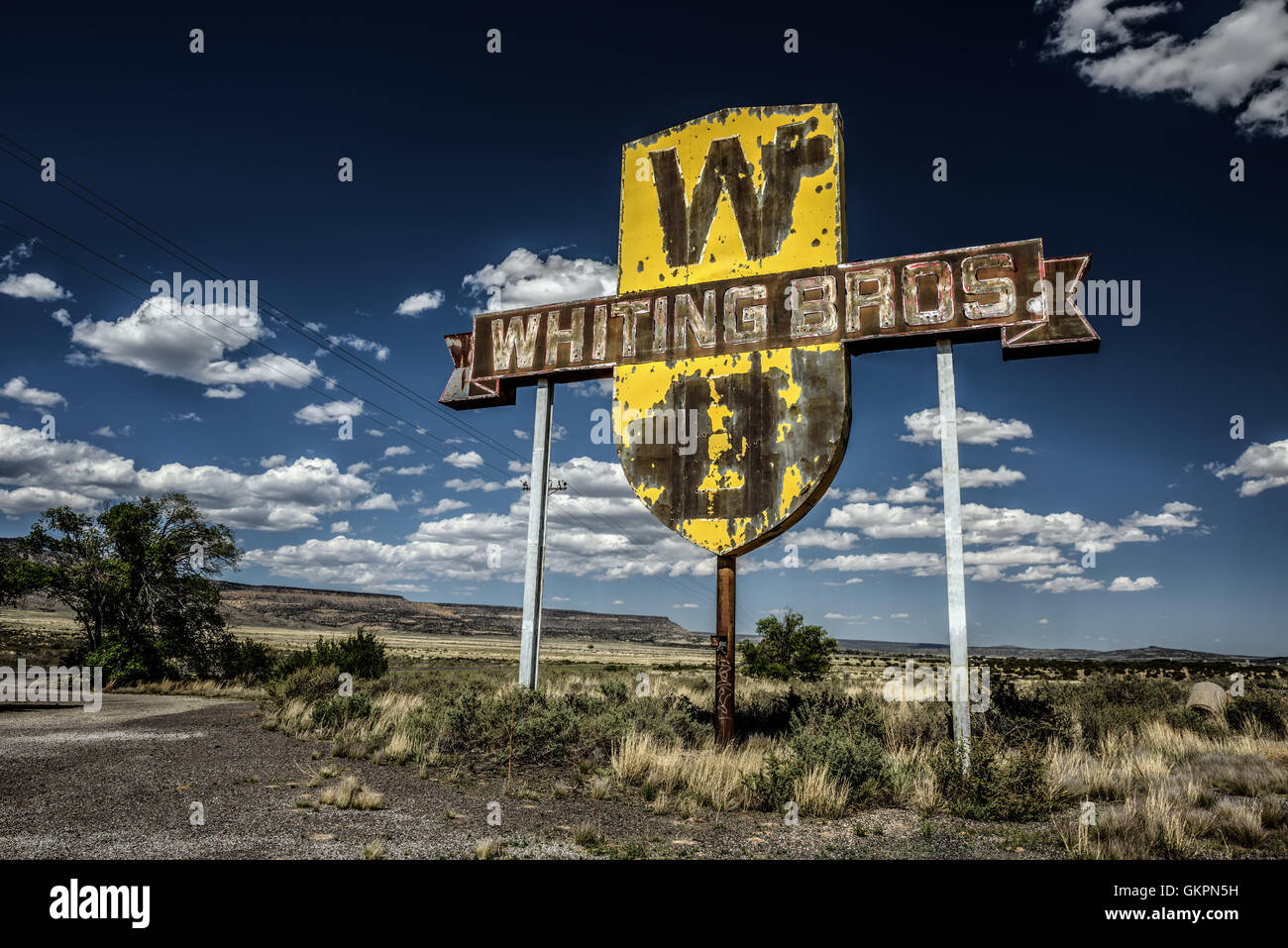 Vintage Whiting Bros. sign above a removed gas station on historic Route 66 in New Mexico. Stock Photo