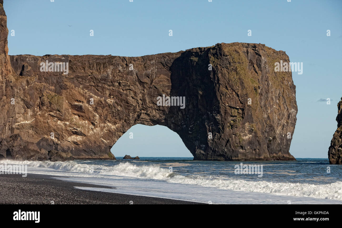 Black Sand Beach at Sunset, Dyrholaey, Iceland  Dyrholaey translated means 'the door hole island' Stock Photo