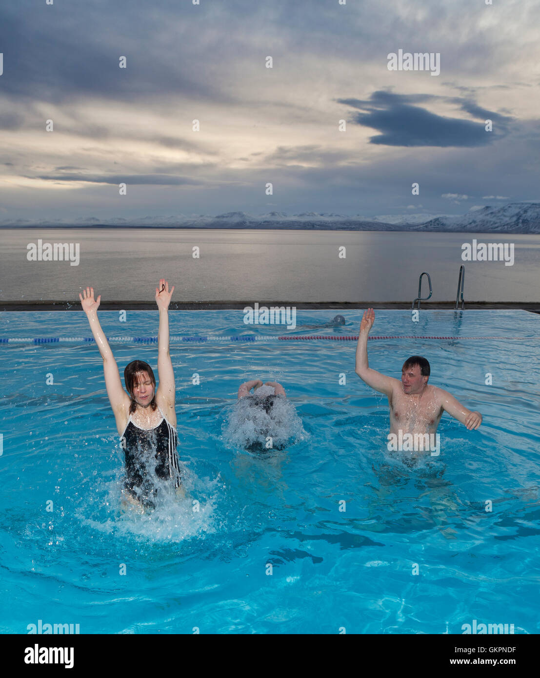 People in the pool having fun, Hofsos, Iceland Stock Photo