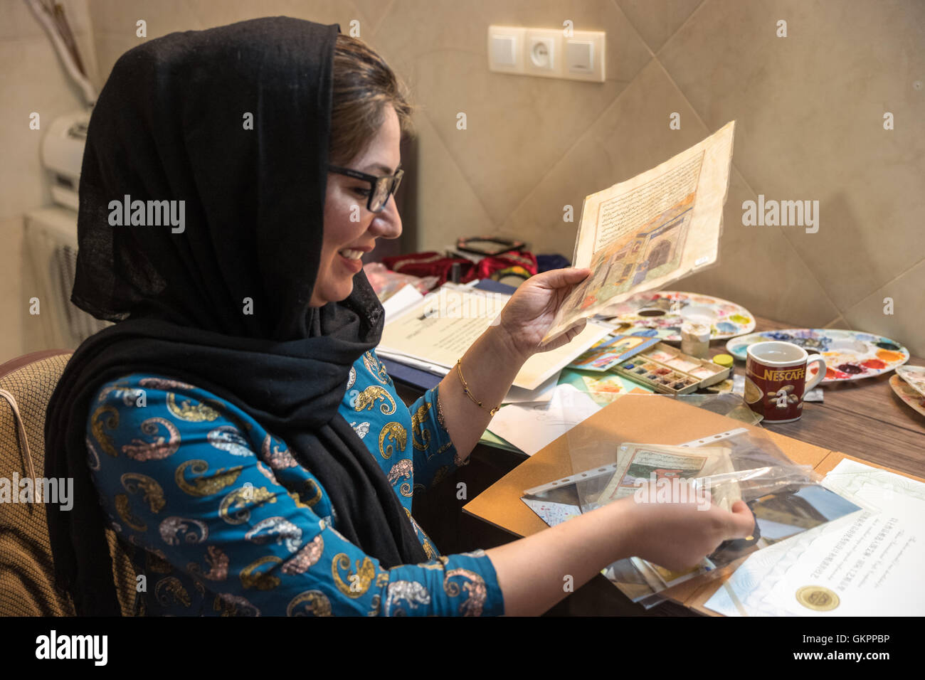 Narsrin Bateni is an award winning miniaturist specializing in traditional Persian miniature paintings in her workshop in Isfahan, Iran. Stock Photo