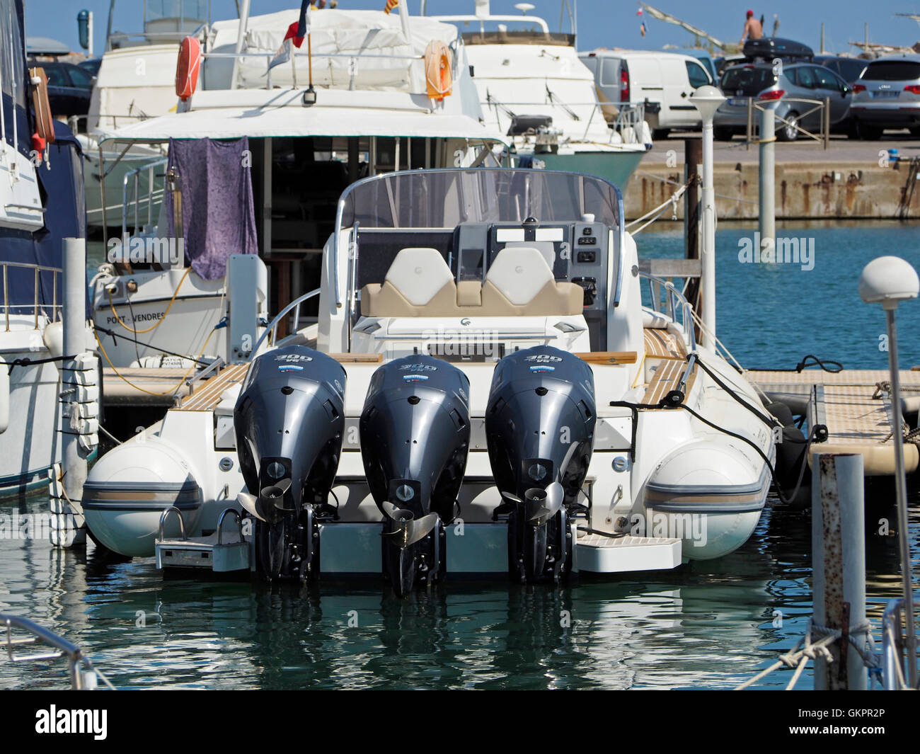 Powerboat rear with 3 big outboard engines in the marina of Le Barcares, pyrenees orientales, southern France Stock Photo