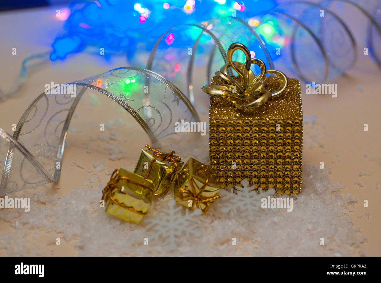 golden gift box and ribbon on abstract background Stock Photo - Alamy