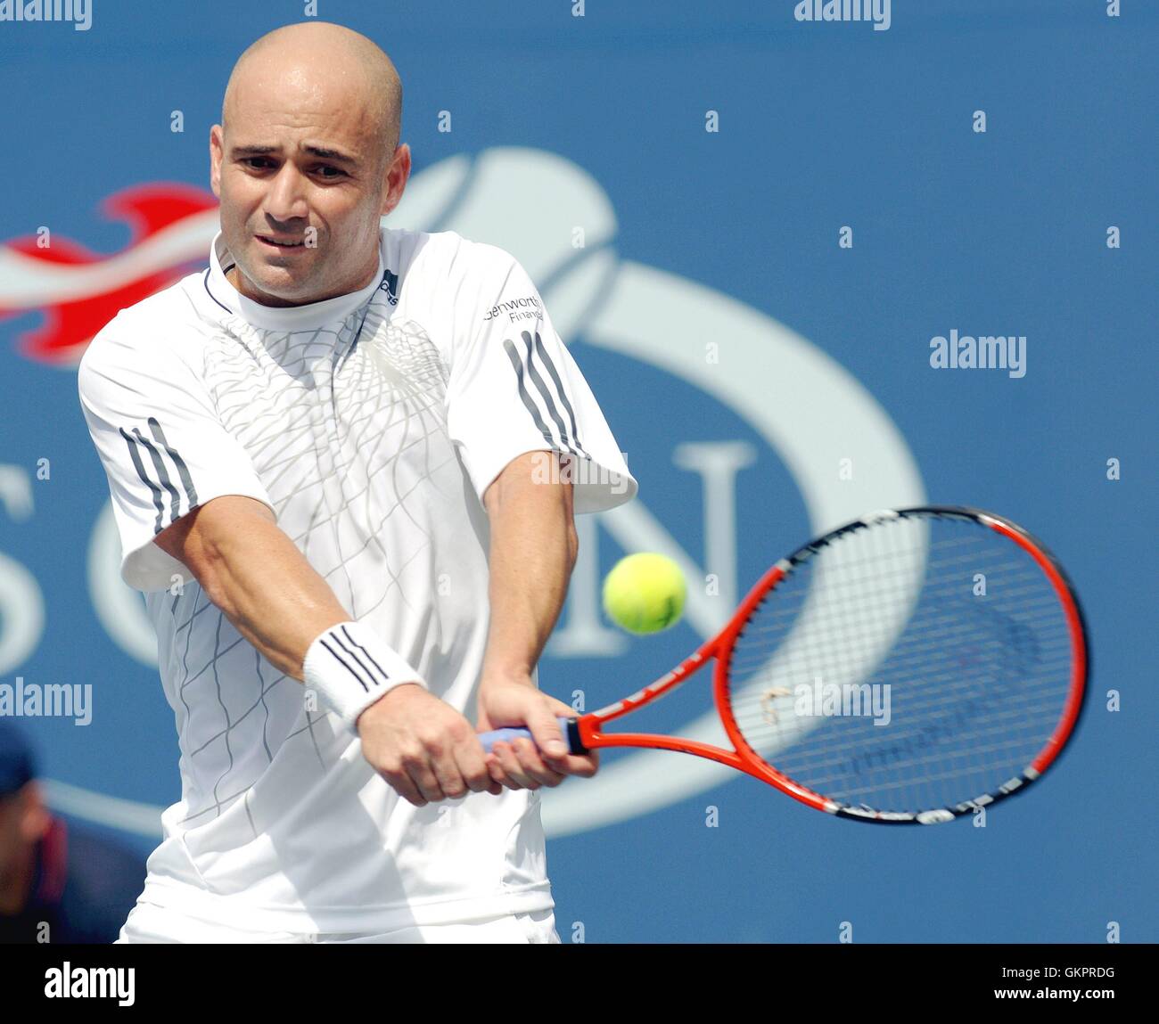 US open at The Billie Jean King National Tennis Center: Andre Agassi Vs.  Benjamin Becker - Andre Agassi waves to the crowd as he walks out on the  court for his match.