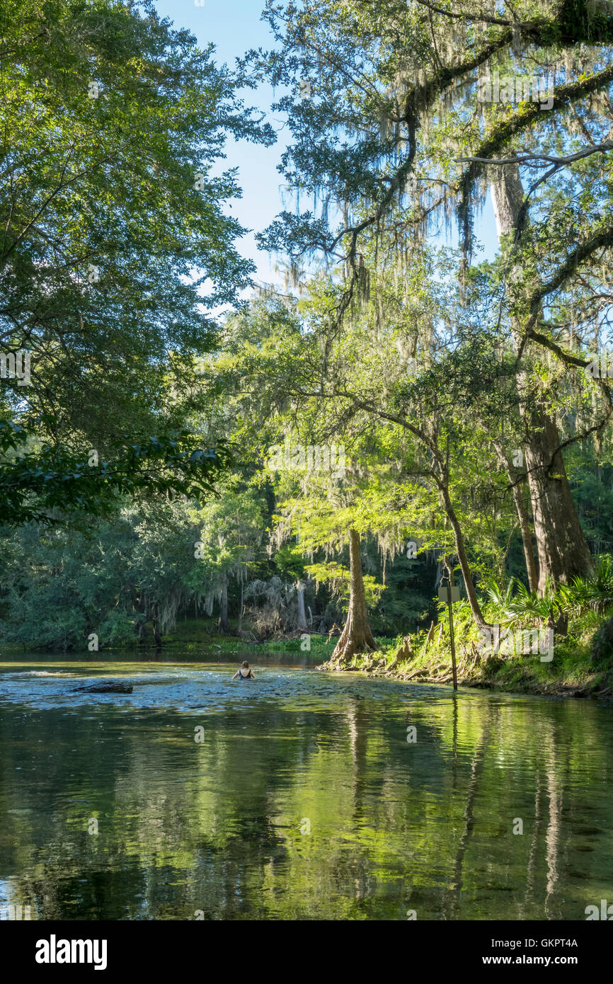 Mature woman swimming in waters where Poe Springs run meets the Santa
