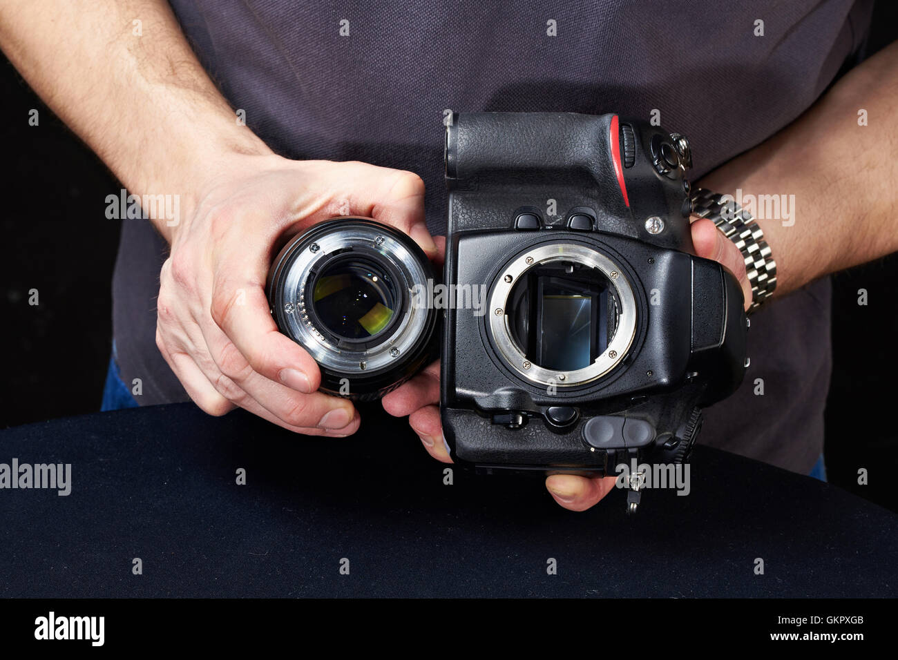Photographer with SLR camera without the lens Stock Photo Alamy