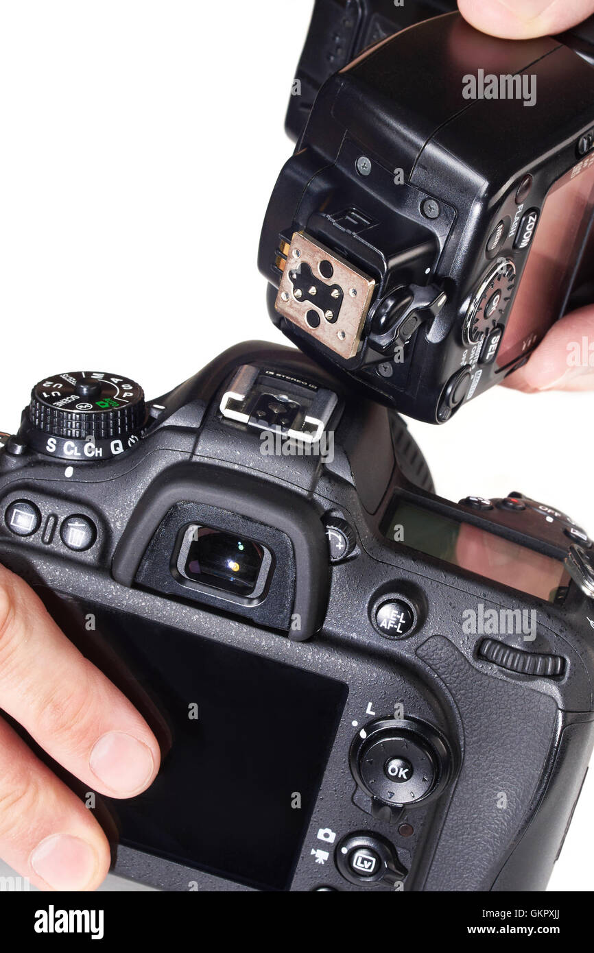 Photographer to set the external flash on a digital SLR camera Stock Photo