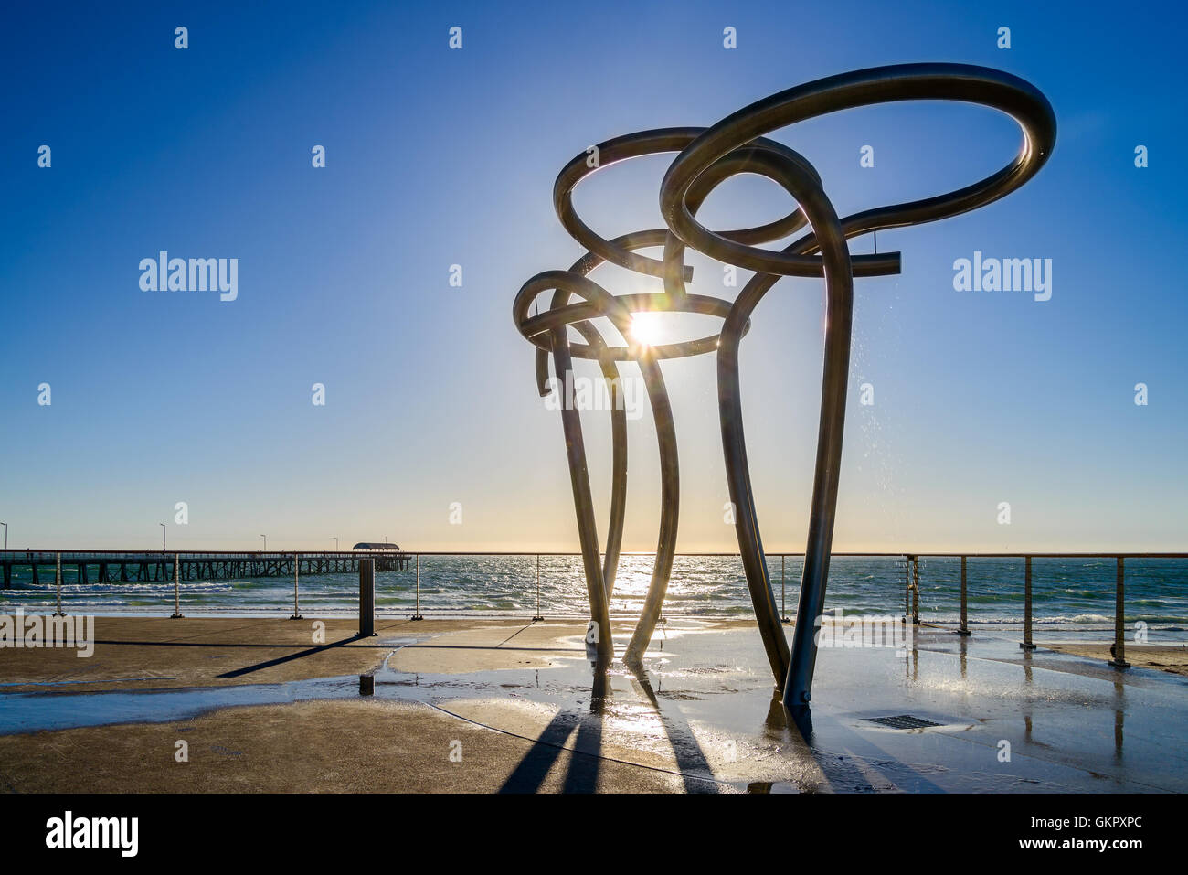 Public showers at Henley Beach with jetty at the background, South Australia Stock Photo Alamy