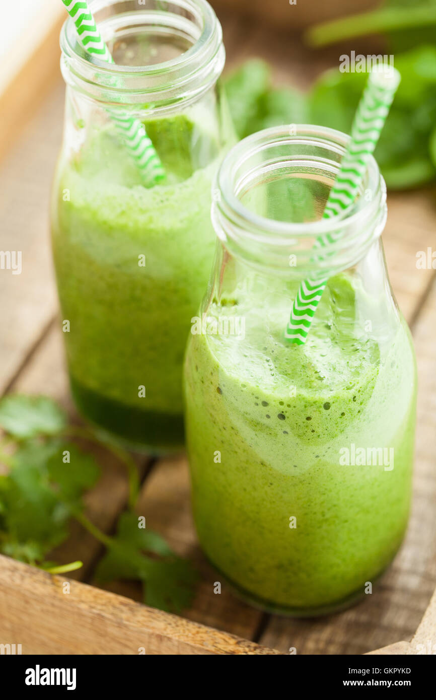 healthy green spinach smoothie with cilantro lime banana ginger Stock Photo