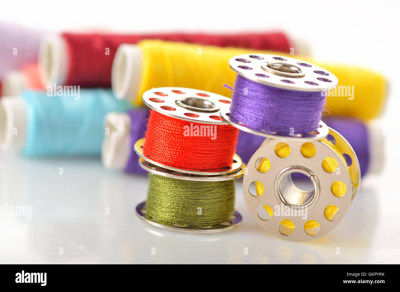 Colored bobbins for machine sewing and threads Stock Photo Alamy