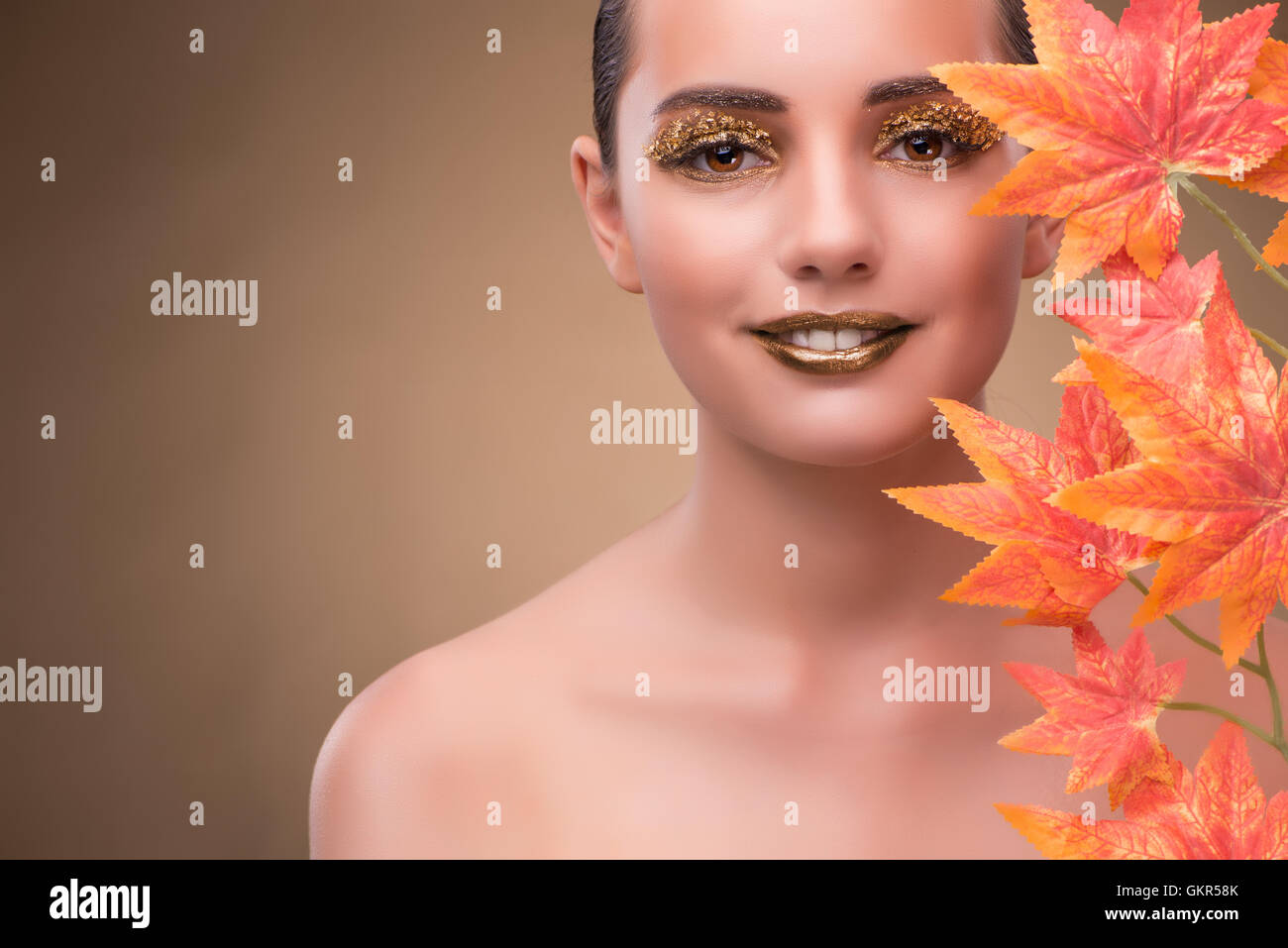 Young woman with dry autumn leaves Stock Photo - Alamy