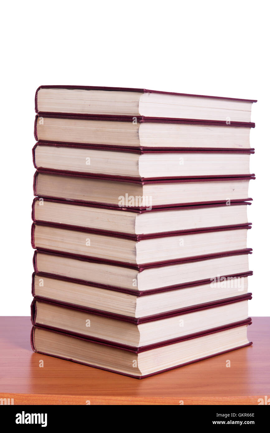 Stack of books arranged the office desk Stock Photo - Alamy