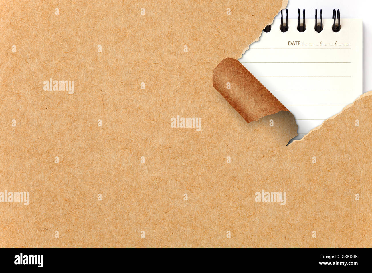 Assortment of ripped Recycle Paper against a Notepad backgrounds Stock ...