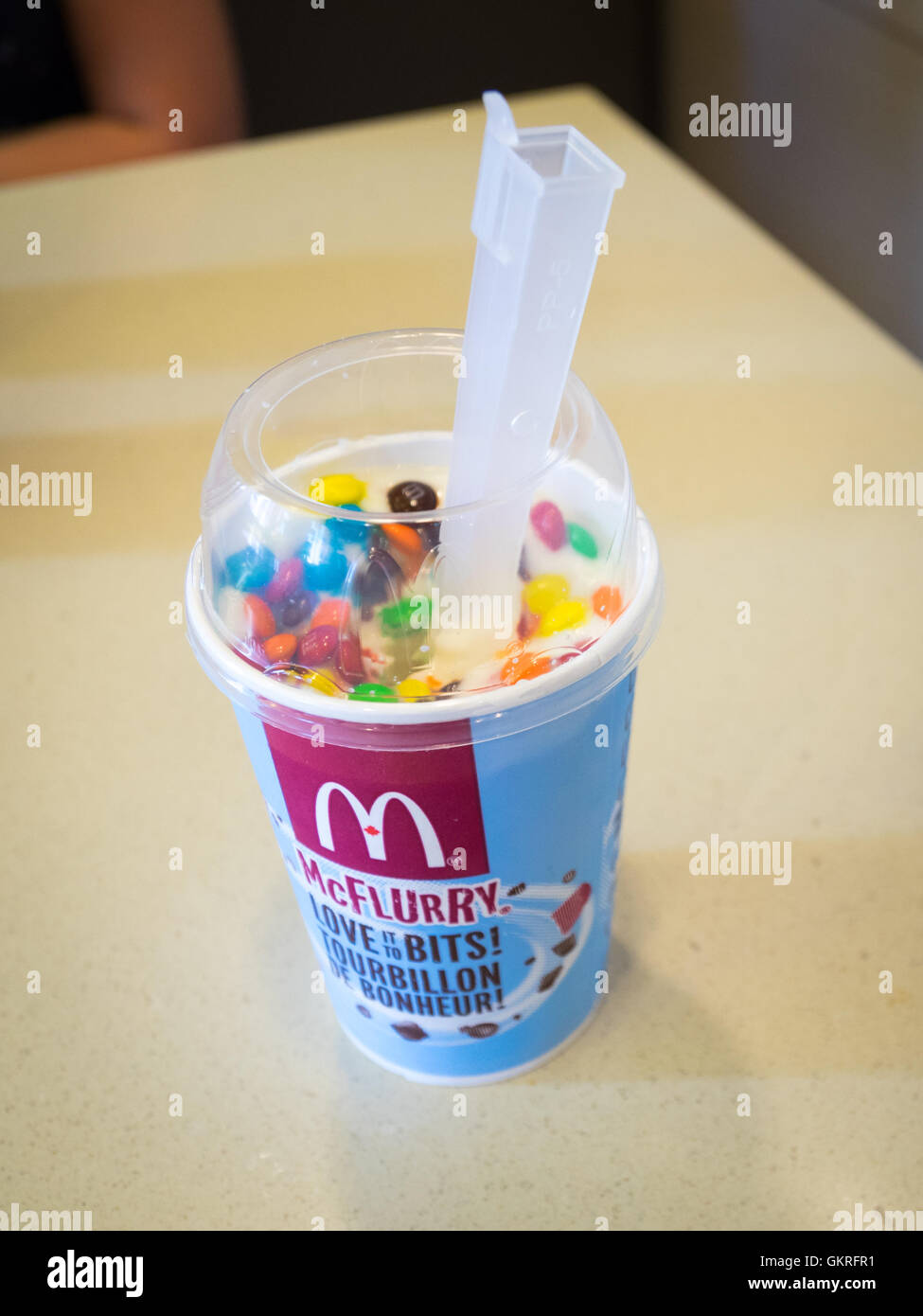 An M&M's McFlurry, soft-serve ice cream dessert from McDonald's. Stock Photo
