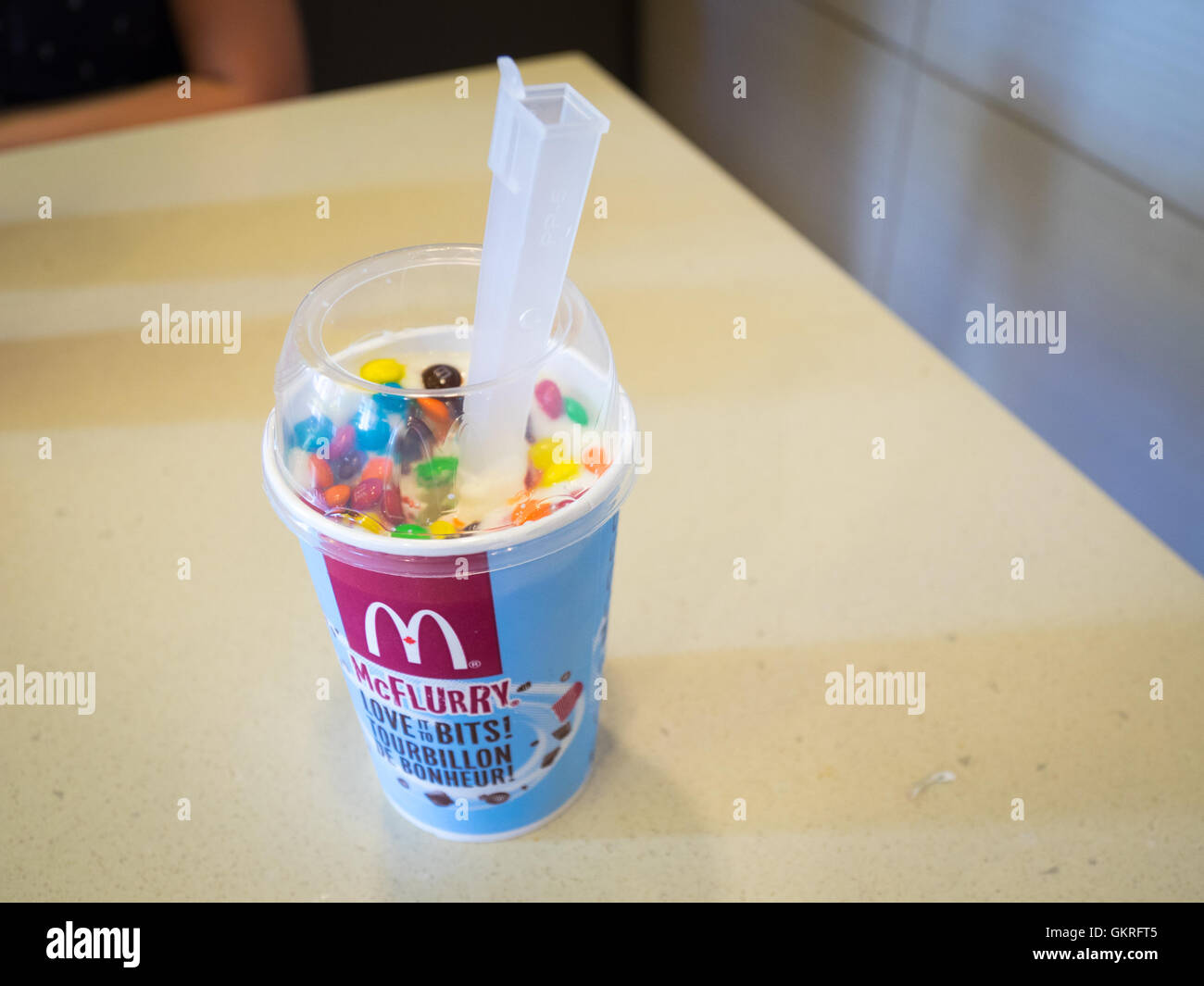 An M&M's McFlurry, soft-serve ice cream dessert from McDonald's. Stock Photo