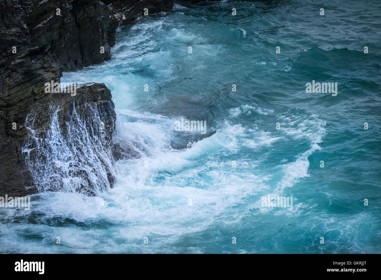 Sea surging around and over rocks on the North Cornwall coast. Stock Photo
