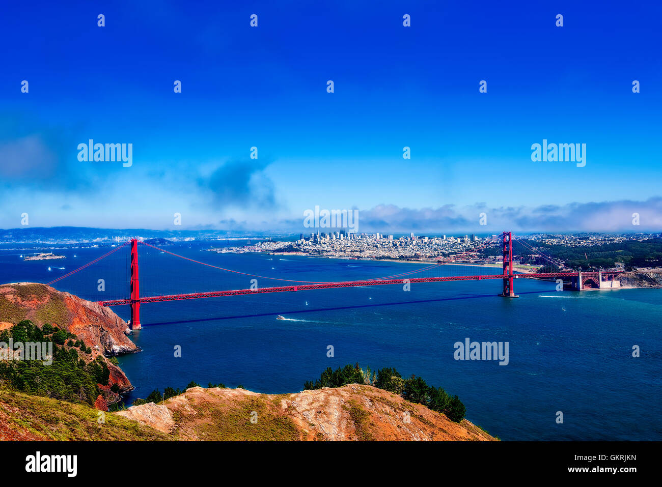 The iconic Golden Gate bridge spans the Golden Gate strait in the city ...