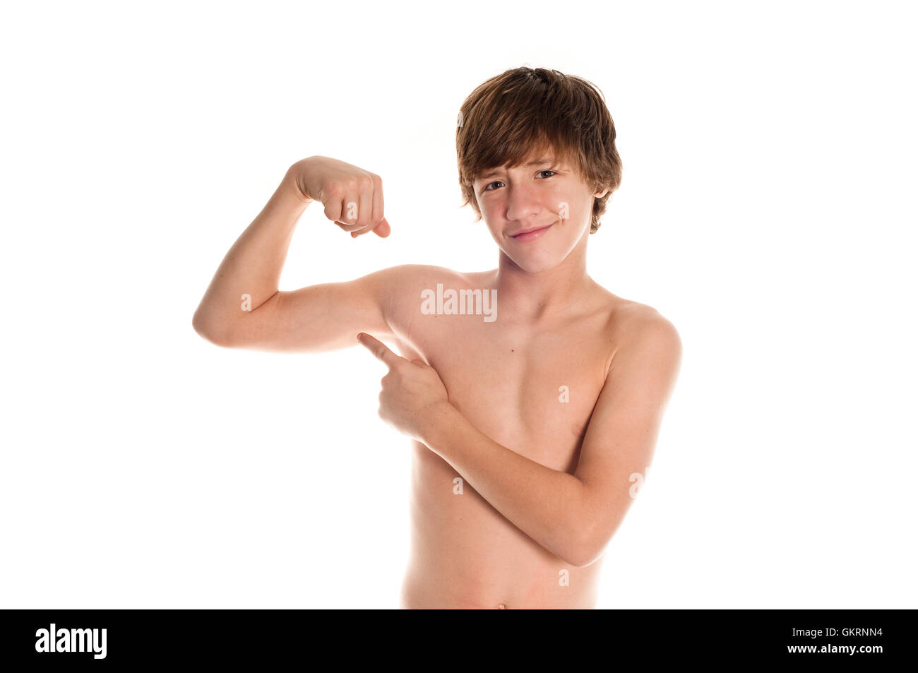 Muscle Teen Points at Bicep Stock Photo