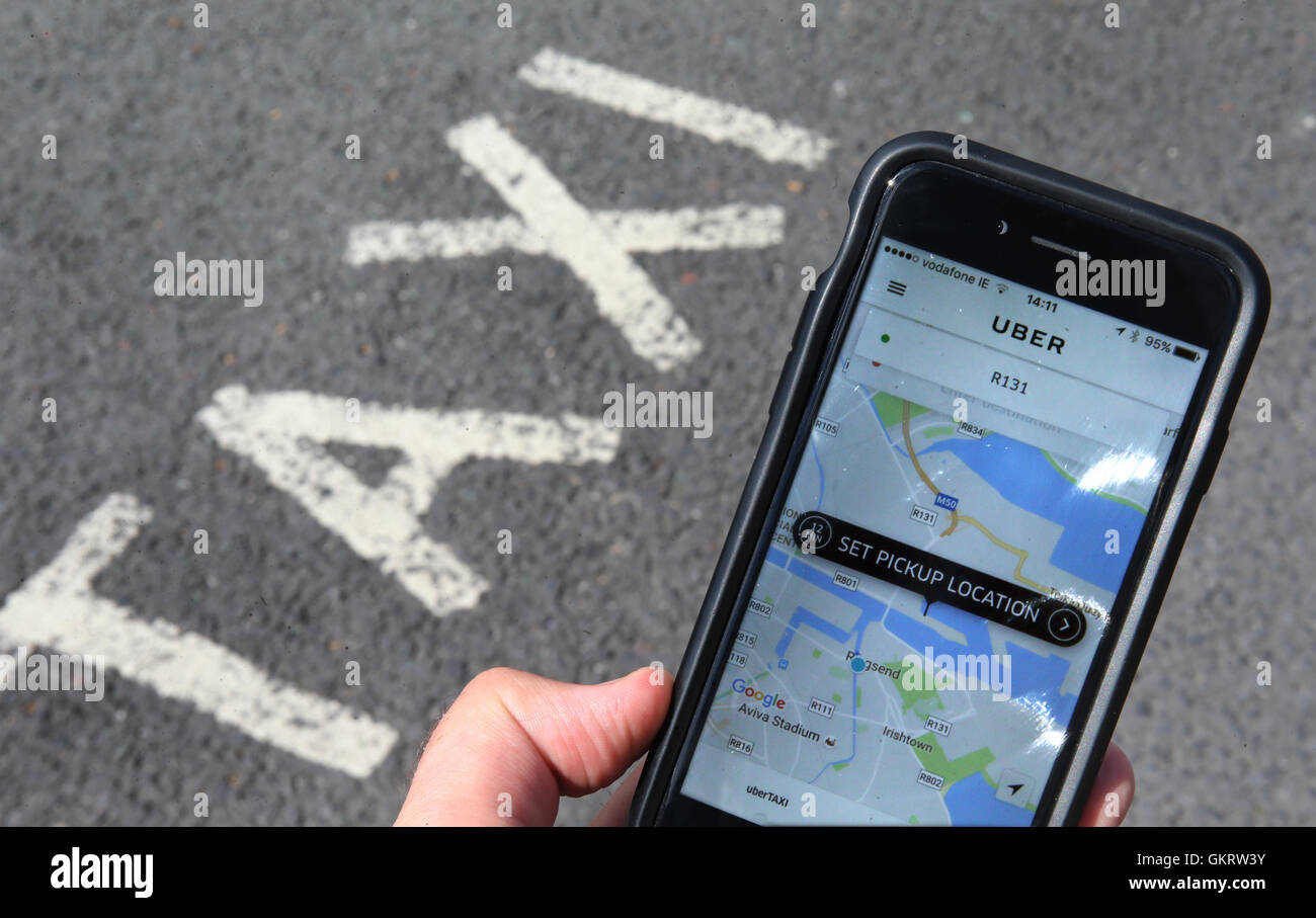 General view of the Uber app open at a taxi rank in Dublin Stock 