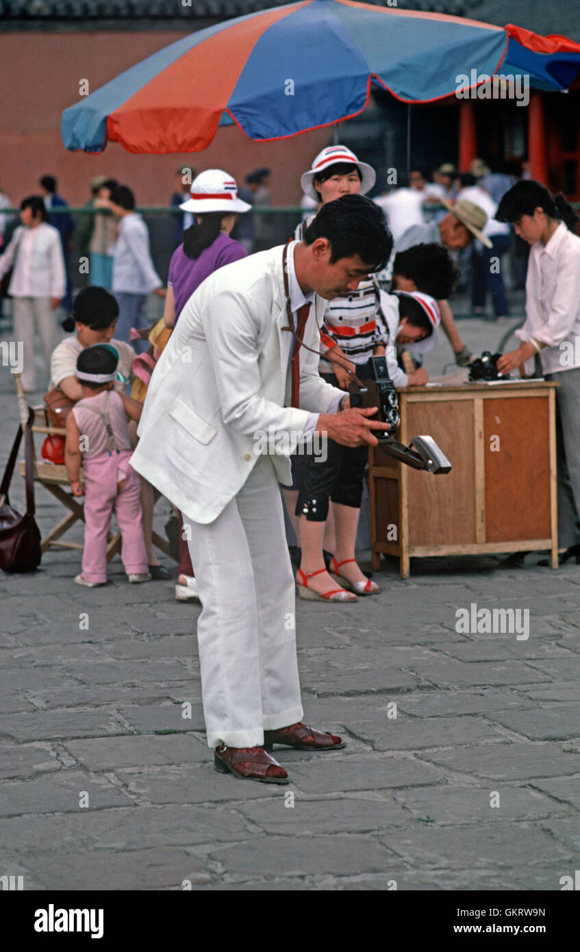 Photographer in white suit, Shenyang, China. Stock Photo