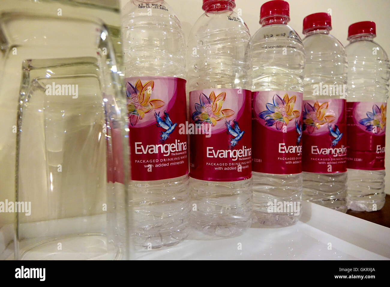 Mineral water bottles and an empty glass Stock Photo Alamy