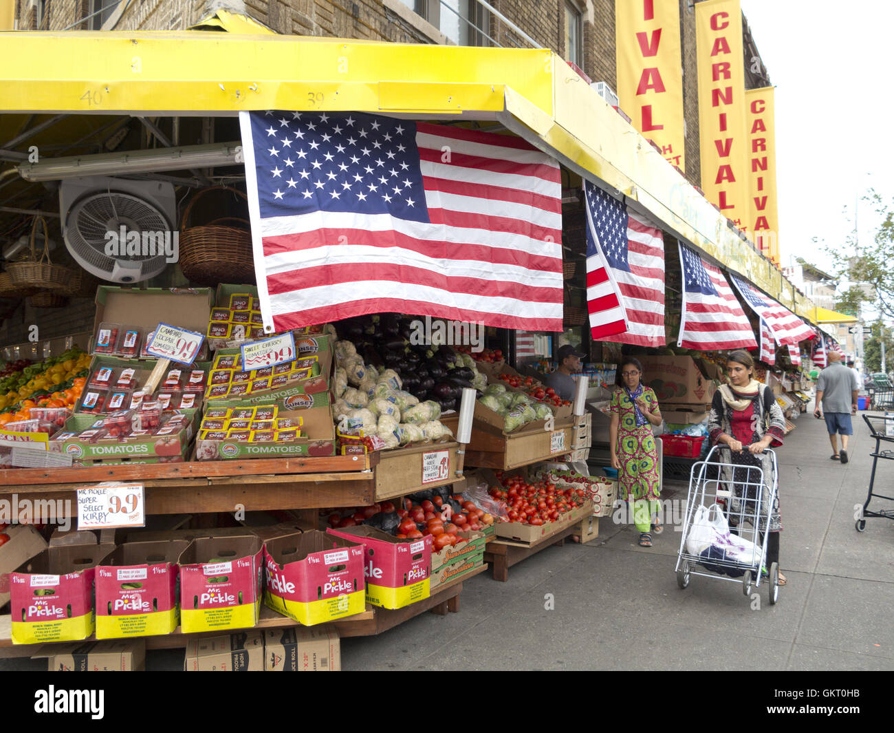 American flags decorate fruit store in 'Little Bangladesh' in the Kensington section of Brooklyn. Stock Photo