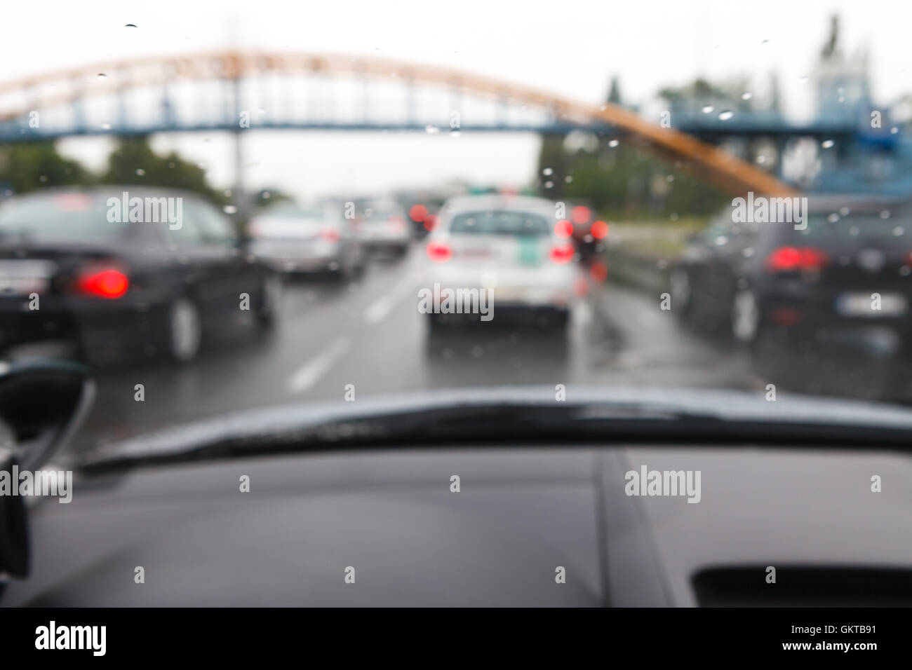 Bad weather conditions driving a car in traffic jam - blurred view Stock Photo