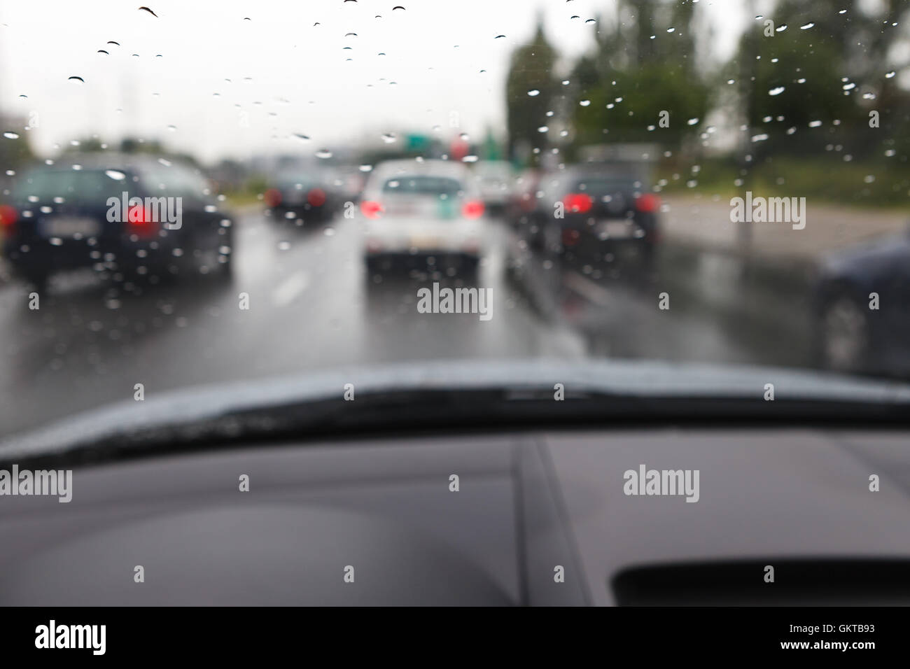 Bad weather conditions driving a car in traffic jam - blurred view Stock Photo