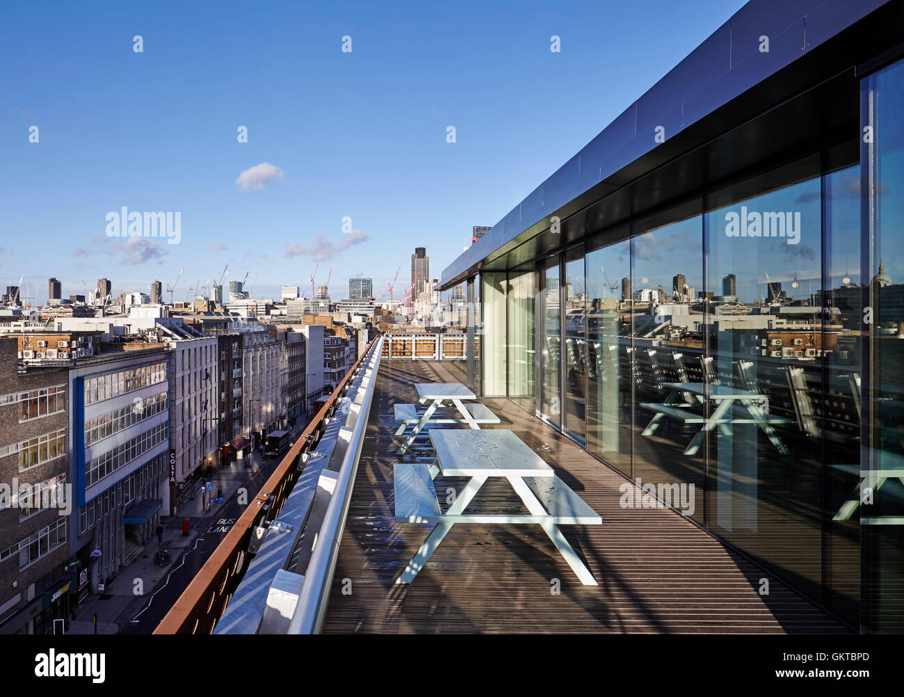 Exterior terrace looking towards the city of London in the sunshine. 201 Borough High Street, London, United Kingdom. Architect: Stiff + Trevillion Architects, 2016. Stock Photo