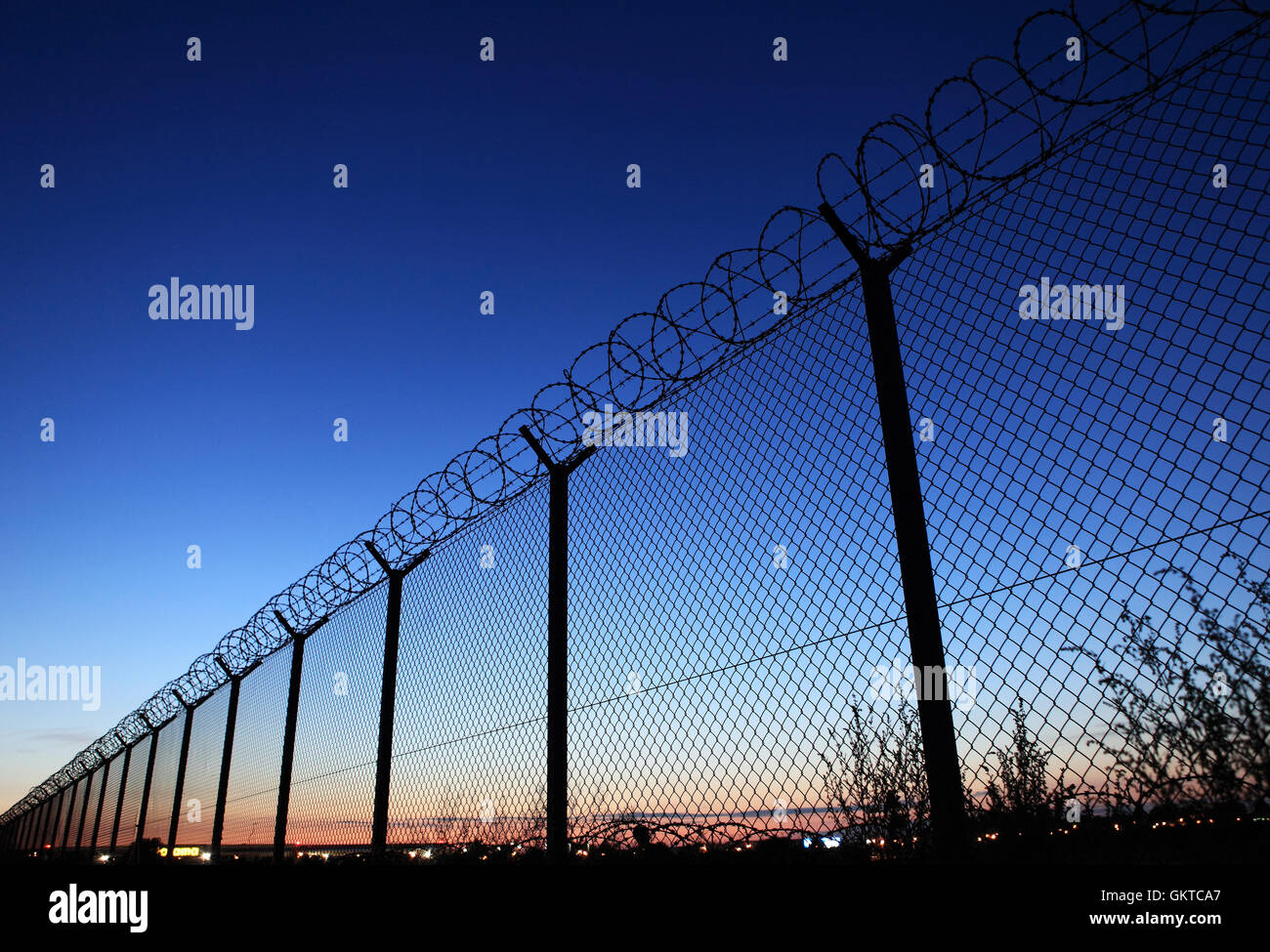 Barbed wire fence of restricted area Stock Photo - Alamy