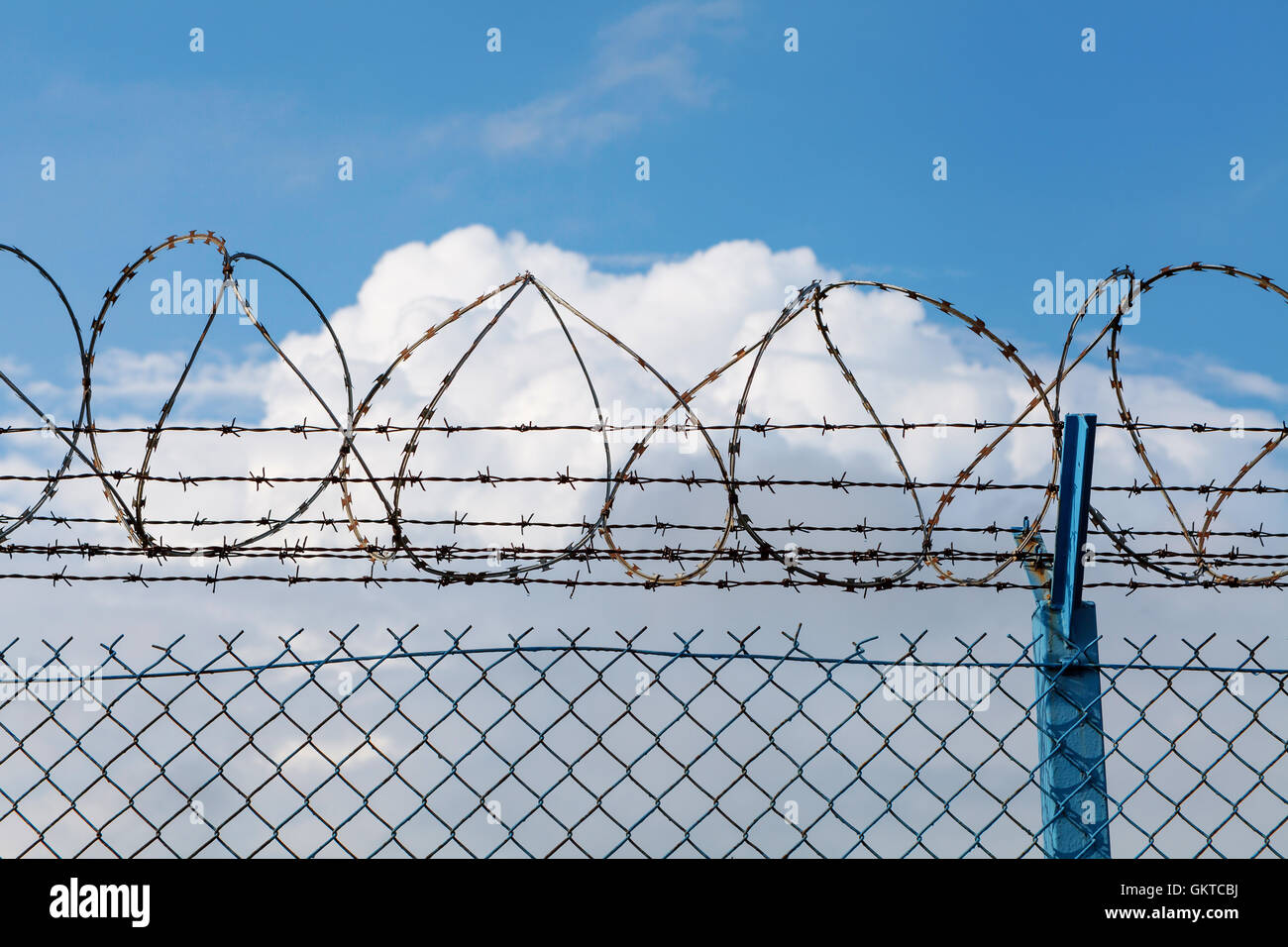 Barbed wire fence of restricted area Stock Photo