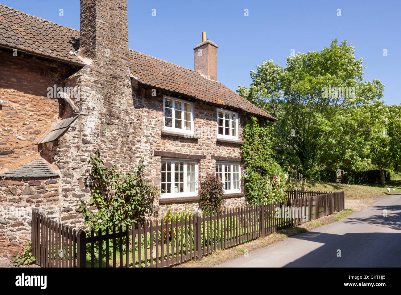 A traditional cottage beside the lane in the Exmoor village of Bossington, Somerset UK Stock Photo