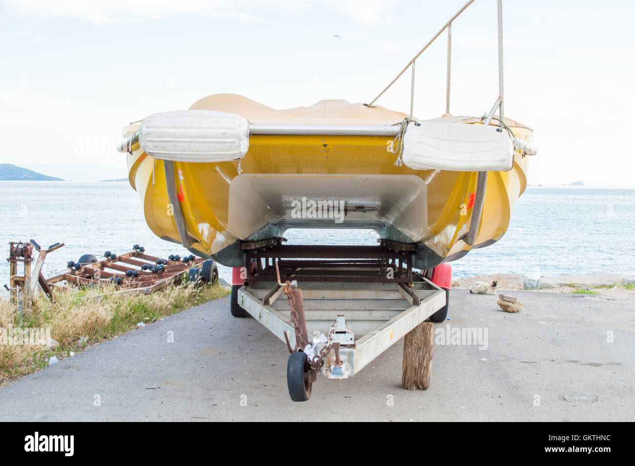 Yellow Boat Left on a Tugboat Stock Photo - Alamy