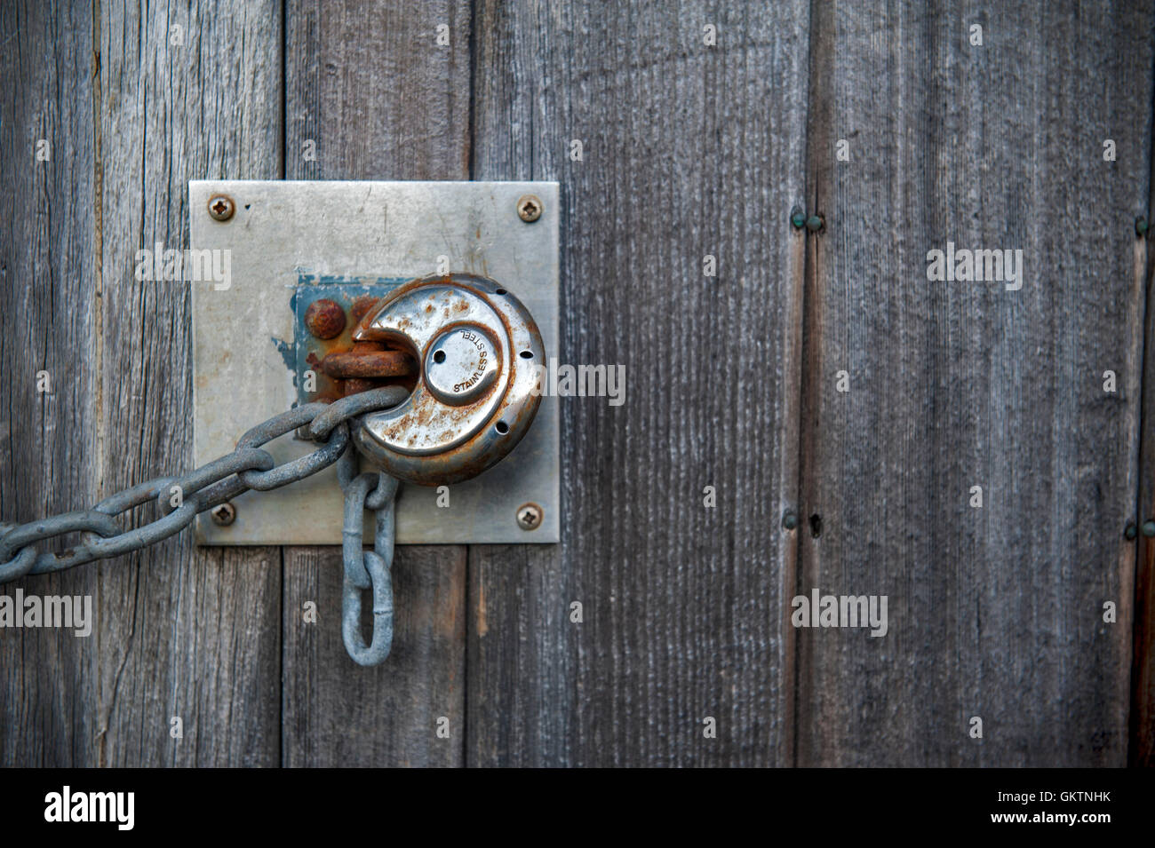 Rusty lock on the old wooden door Stock Photo - Alamy