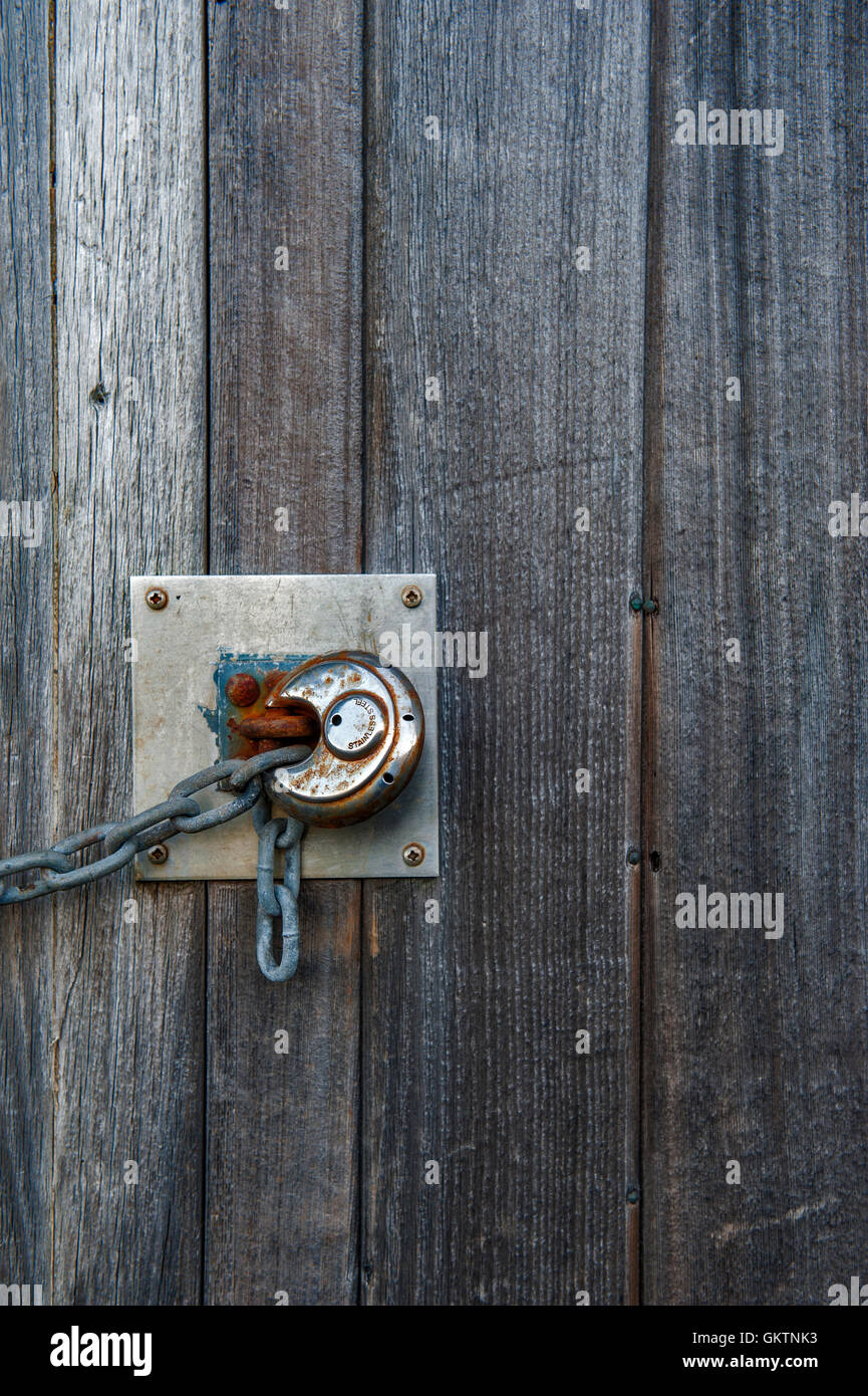 Rusty lock on the old wooden door Stock Photo - Alamy