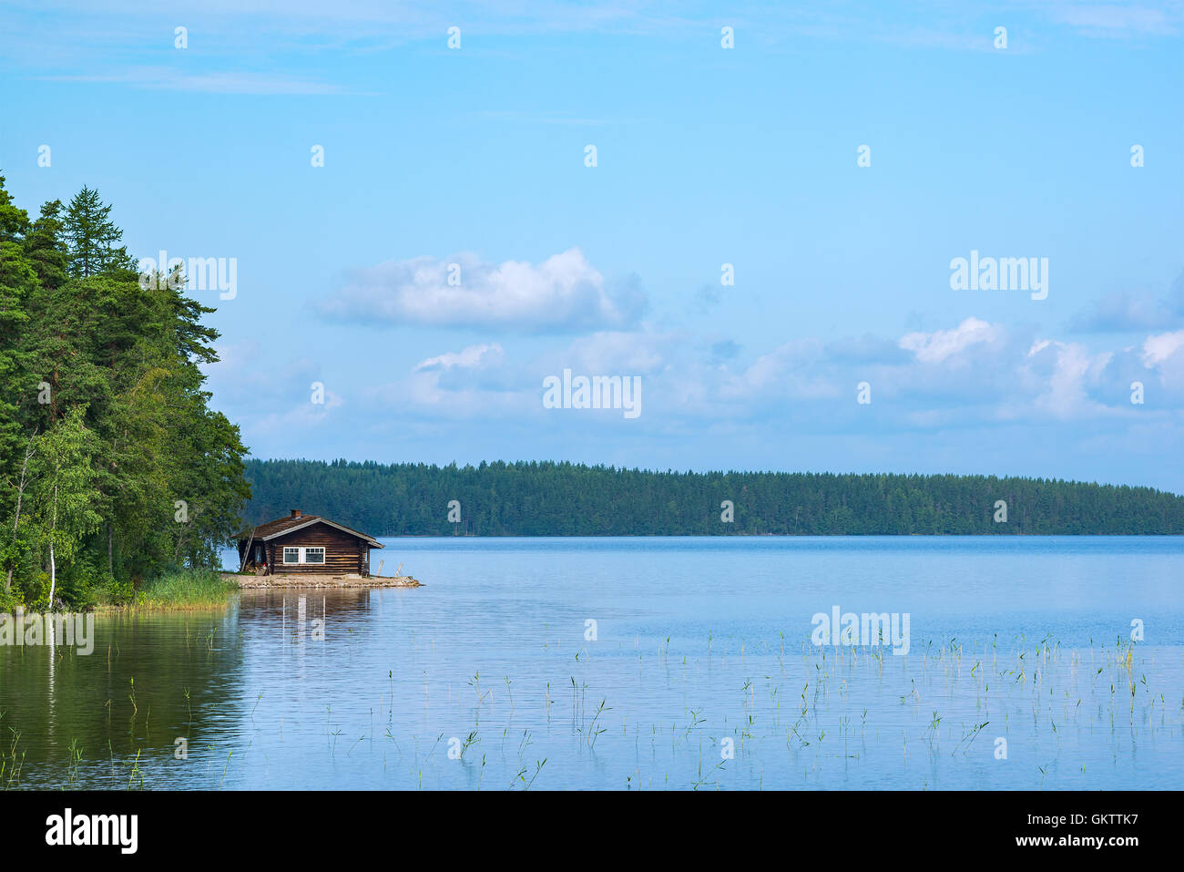 Small cabin in shore of lake in eastern Finland Stock Photo