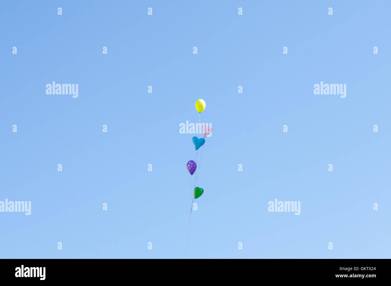 Heart-shaped balloons in the sky Stock Photo - Alamy