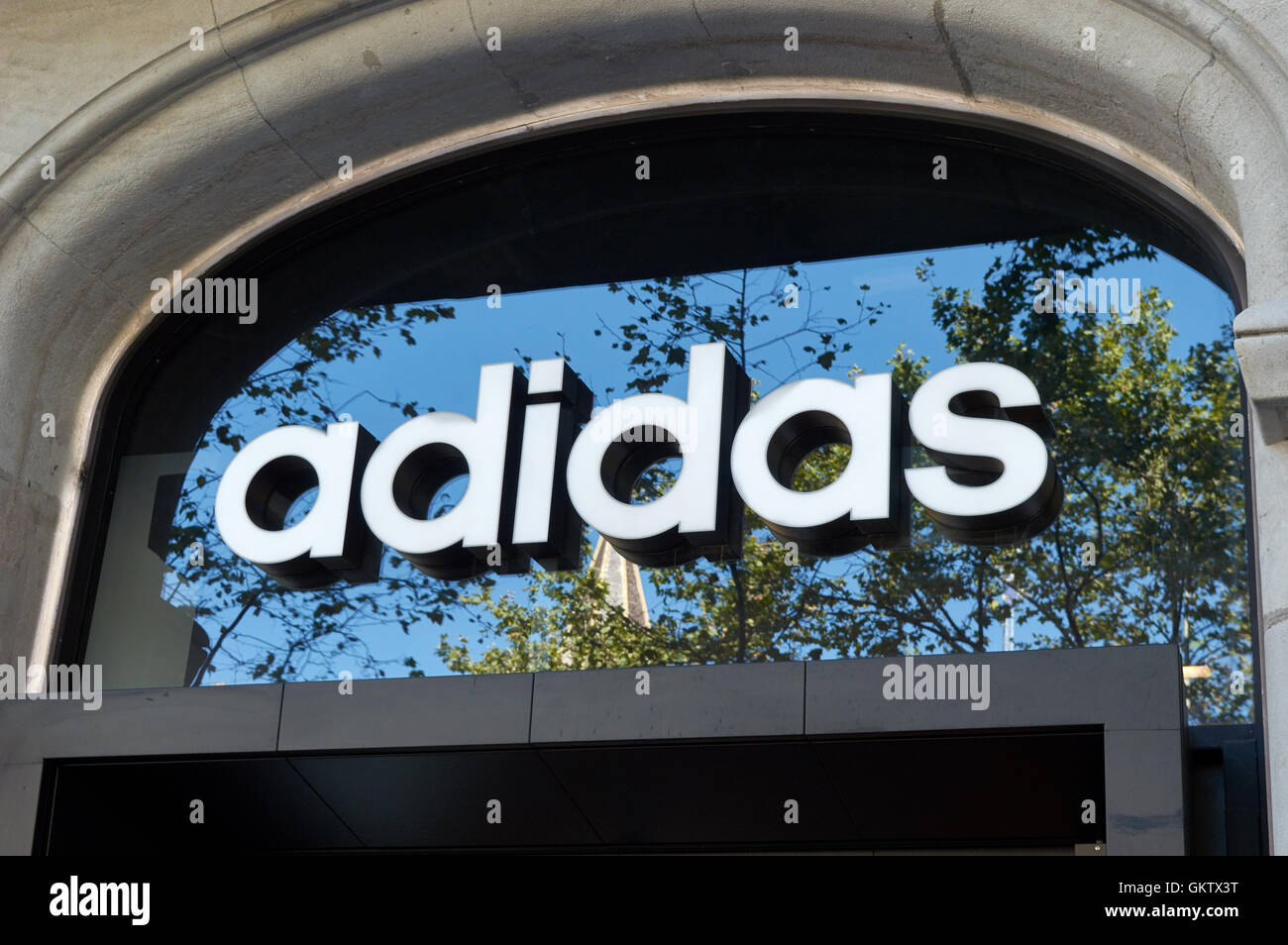 Adidas logo on above entrance to shop on Passeig de Gràcia Stock Photo -  Alamy