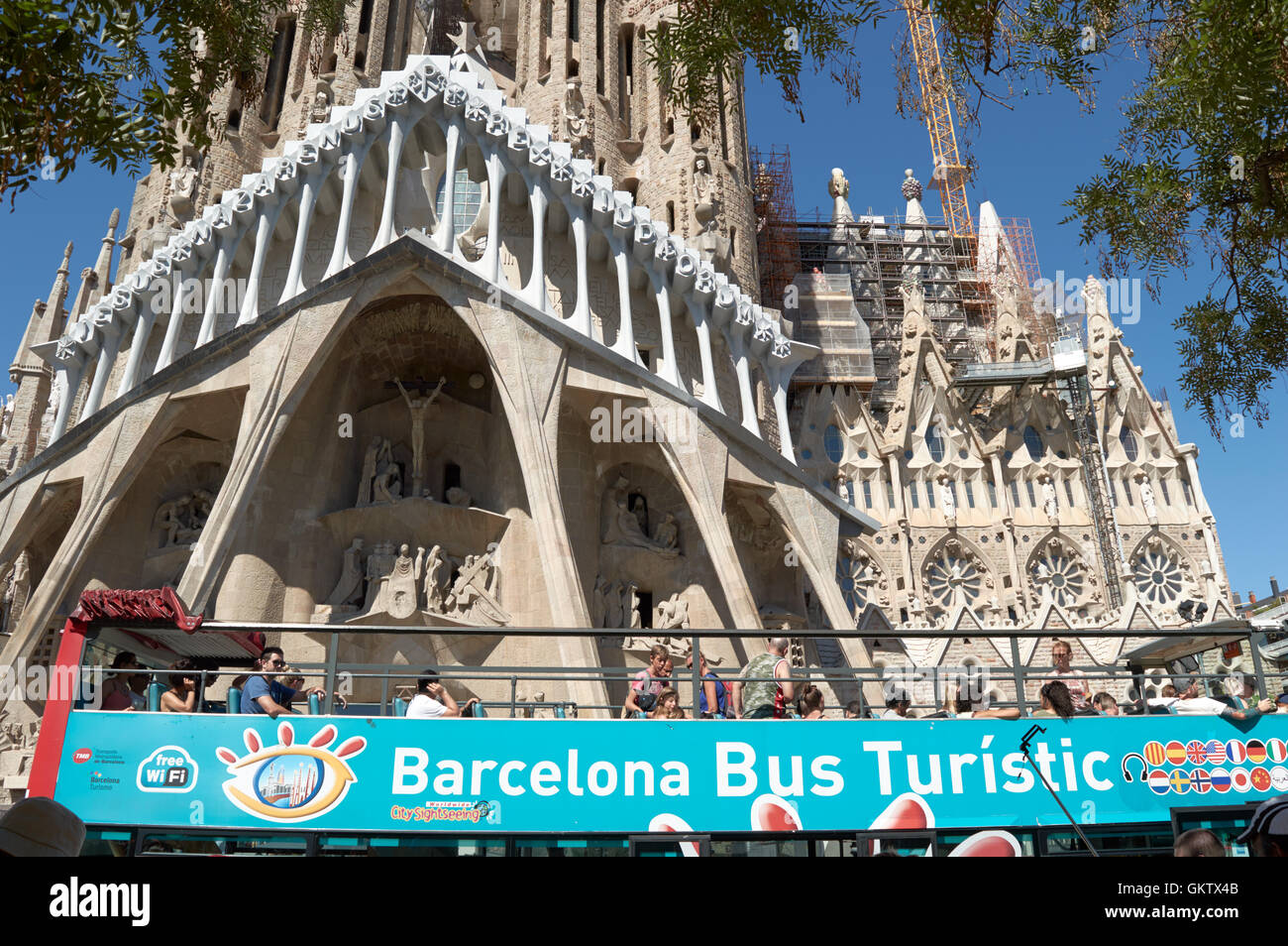 Barcelona Tour Bus outside the Antoni Gaudi church / cathedral (Sagrada Família), Barcelona, Catalonia, Spain Stock Photo