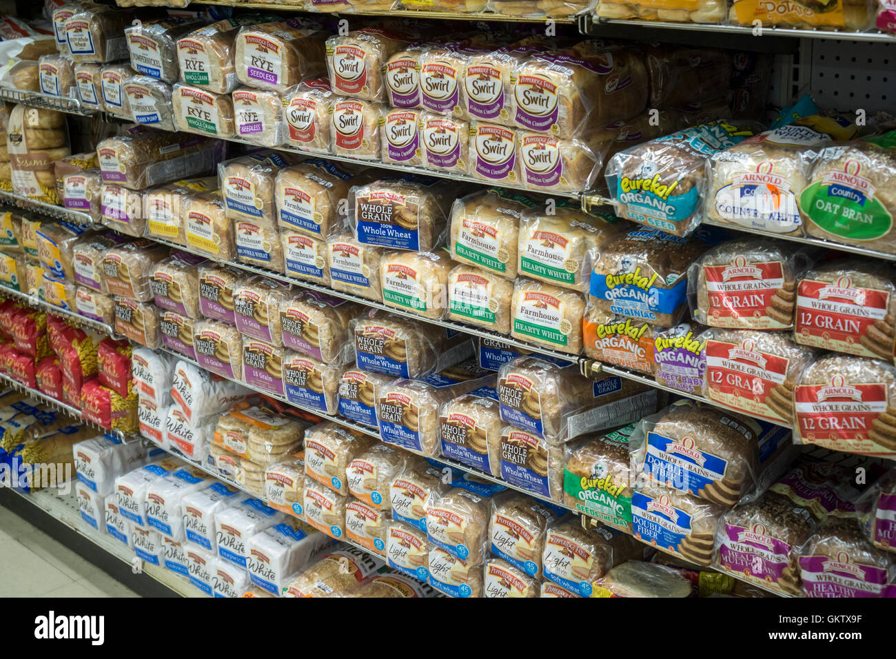 Loaves of different varieties of Pepperidge Farm breads and other brands are seen on a supermarket shelf in New York on Saturday, August 13, 2016. (© Richard B. Levine) Stock Photo