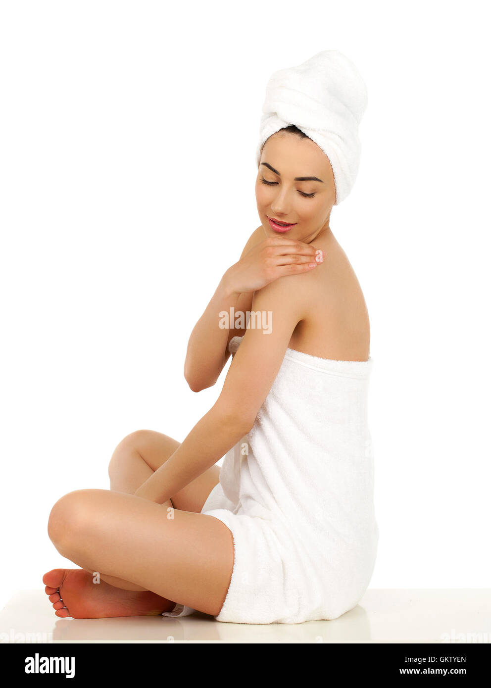 Full length portrait of a beautiful young woman wrapped towel isolated ...