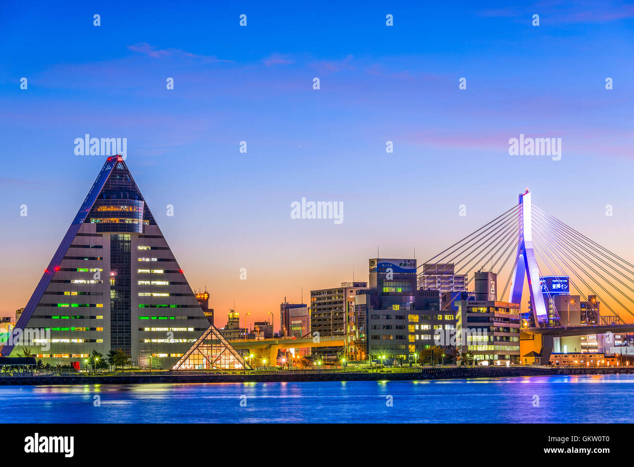 AOMORI, JAPAN - OCTOBER 26, 2012: The Aomori Prefecture Tourist Center and Aomori Bay Bridge at dusk. The city is the capital of Stock Photo