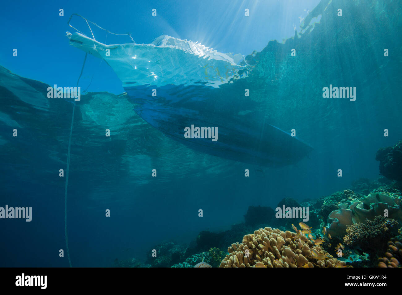 Diving Boat over Coral Reef, Ambon, Moluccas, Indonesia Stock Photo