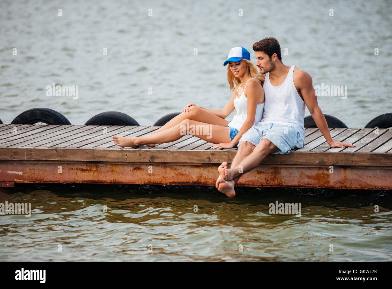 Barefoot woman man sitting hi-res stock photography and images - Alamy