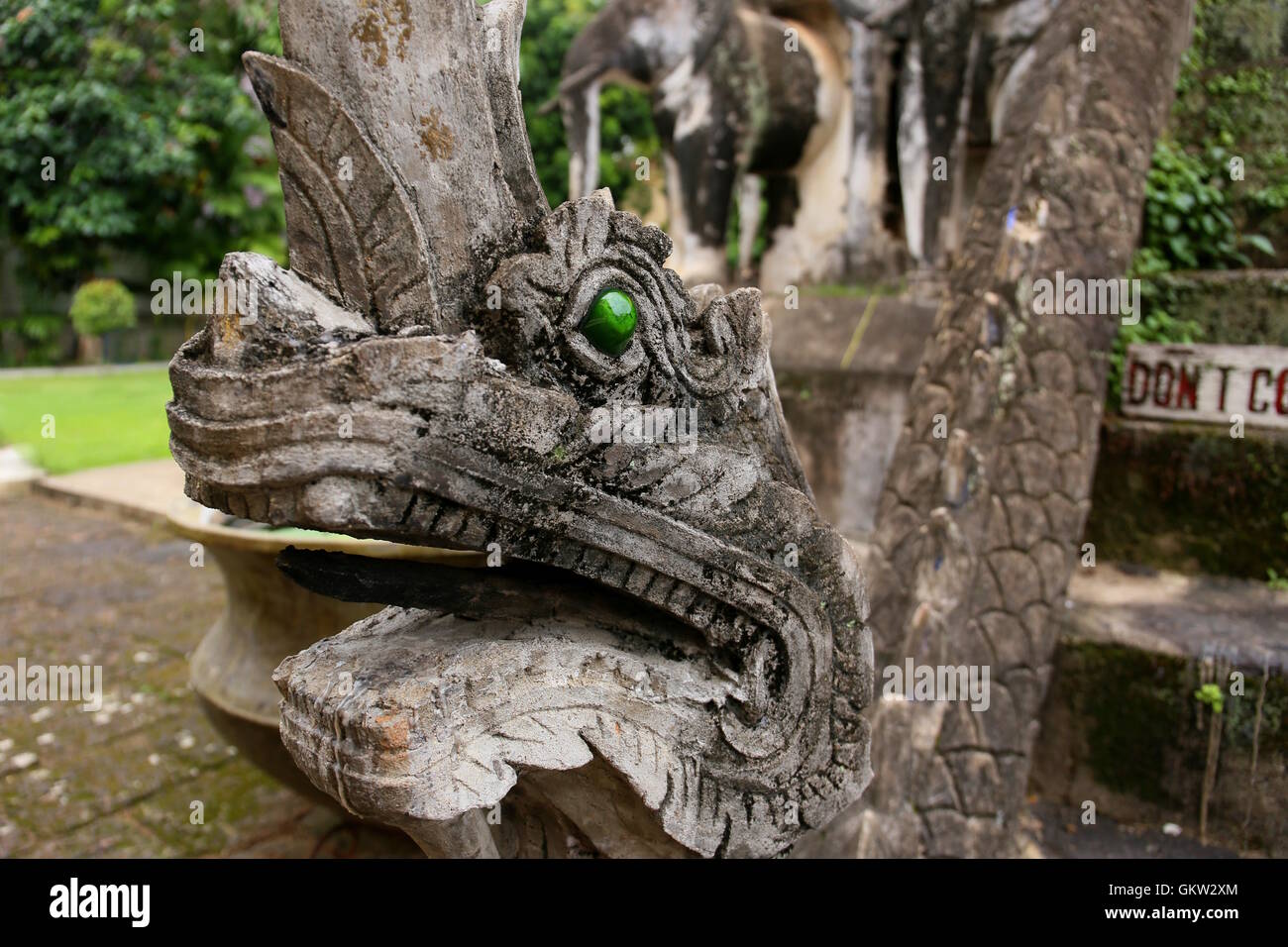 Dragon head stone statue in Chiang Man temple, Chiang Mai Stock Photo